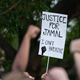 Protestors raise their fists, calling for justice for Jamal Sutherland at Marion Square on May 17, 2021, in Charleston, South Carolina. Sutherland, a black man suffering from mental illness, died after Charleston County deputies shocked him with a stun gun when removing him from a jail cell. Activists want charges brought against the deputies.